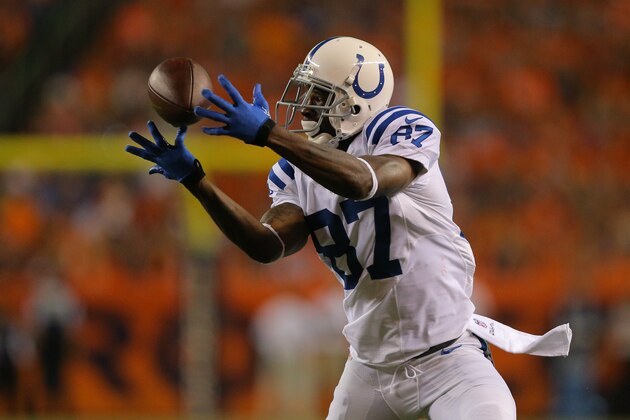 DENVER, CO - SEPTEMBER 7:  Wide receiver Reggie Wayne #87 of the Indianapolis Colts makes a catch against the Denver Broncos at Sports Authority Field at Mile High on September 7, 2014 in Denver, Colorado.  (Photo by Justin Edmonds/Getty Images)