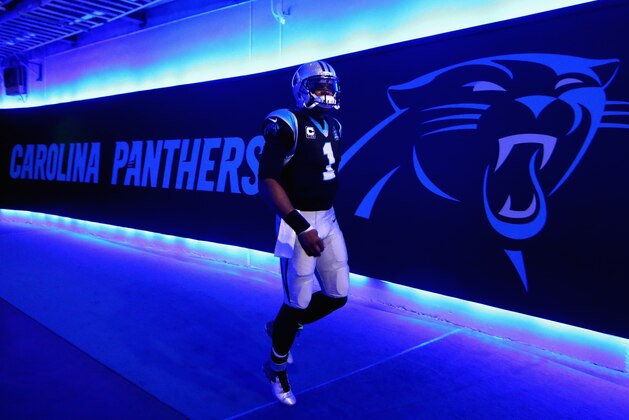 CHARLOTTE, NC - OCTOBER 26:  Cam Newton #1 of the Carolina Panthers runs out to be introduced before their game against the Seattle Seahawks at Bank of America Stadium on October 26, 2014 in Charlotte, North Carolina.  (Photo by Streeter Lecka/Getty Images)