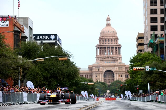 AUSTIN, TX - OCTOBER 29:  Sebastian Vettel of Germany and Infiniti Red Bull Racing drives along North Congress Avenue backdropped by the Texas Capitol building during previews ahead of the United States Formula One Grand Prix on the streets of Austin on October 29, 2014 in Austin, United States.  (Photo by Mark Thompson/Getty Images)