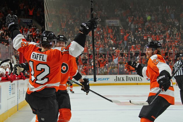 PHILADELPHIA, PA - OCTOBER 25: Michael Raffl #12 of the Philadelphia Flyers celebrates his third period goal against the Detroit Red Wings with Jakub Voracek #93 and Claude Giroux #28 on October 25, 2014 at the Wells Fargo Center in Philadelphia, Pennsylvania.  (Photo by Len Redkoles/NHLI via Getty Images)