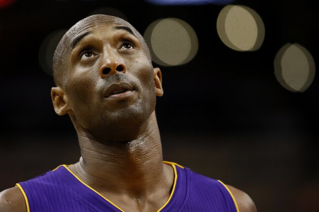Los Angeles Lakers guard Kobe Bryant (24) looks at the scoreboard during the second half of an NBA basketball game against the Phoenix Suns, Wednesday, Oct. 29, 2014, in Phoenix. The Suns won 119-99. (AP Photo/Matt York)