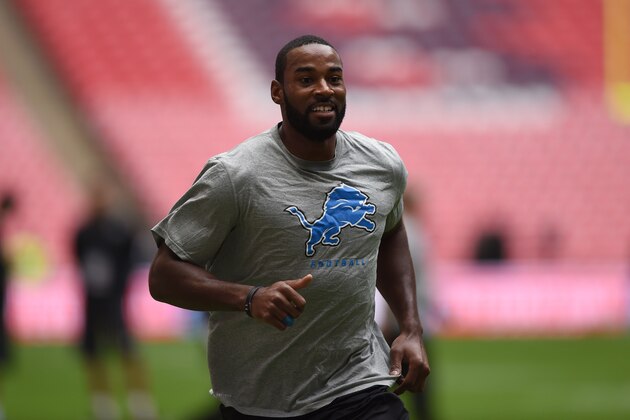 Detroit Lions wide receiver Calvin Johnson (81), centre, smiles as he warms-up before the NFL football game against the Atlanta Falcons at Wembley Stadium, London, Sunday, Oct. 26, 2014.