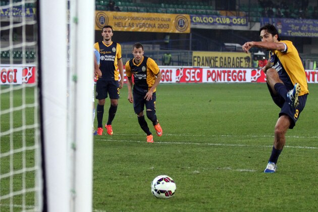 Hellas Verona forward Luca Toni scores on a penalty kick during a Serie A soccer match against Lazio at Bentegodi stadium in Verona, Italy, Thursday, Oct. 30, 2014. (AP Photo/Felice Calabro')