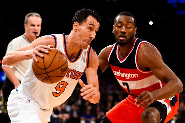 NEW YORK, NY - OCTOBER 22: Pablo Prigioni #9 of the New York Knicks drives against John Wall #2 of the Washington Wizards in a preseason game at Madison Square Garden on October 22, 2014 in New York City. NOTE TO USER: User expressly acknowledges and agrees that, by downloading and/or using this photograph, user is consenting to the terms and conditions of the Getty Images License Agreement.  (Photo by Alex Goodlett/Getty Images)