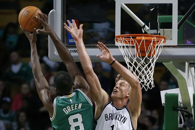 Brooklyn Nets forward Mason Plumlee (1) defends the basket against Boston Celtics forward Jeff Green (8) in the first quarter of an NBA basketball game in Boston, Wednesday, Oct. 29, 2014. (AP Photo/Elise Amendola)
