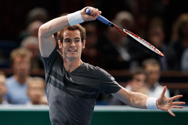 PARIS, FRANCE - OCTOBER 30:  Andy Murray of Great Britain in action against Grigor Dimitrov of Bulgaria during day 4 of the BNP Paribas Masters held at the at Palais Omnisports de Bercy on October 30, 2014 in Paris, France.  (Photo by Dean Mouhtaropoulos/Getty Images)