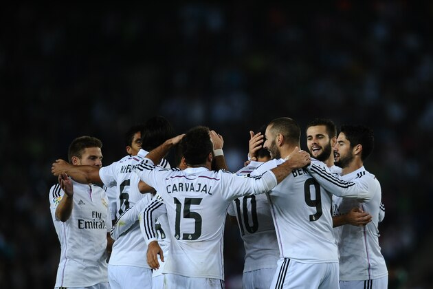 Real Madrid's players celebrate Chicharito's goal against Cornella during a Copa del Rey soccer match in Cornella Llobregat, Spain, Wednesday, Oct. 29, 2014. (AP Photo/Manu Fernandez)