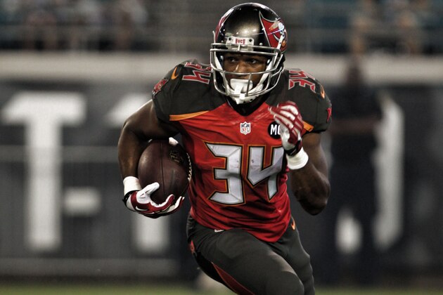 Running back Charles Sims #34 of the Tampa Bay Buccaneers runs the ball during a Pre-Season NFL football game against the Jacksonville Jaguars, Friday, Aug. 8, 2014, in Jacksonville, Fla. (Photo by Marc Serota/Panini/AP Images)