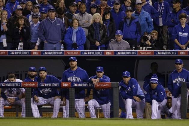 Kansas City Royals players watch from their dugout the seventh inning of Game 7 of baseball's World Series against the San Francisco Giants Wednesday, Oct. 29, 2014, in Kansas City, Mo. (AP Photo/Charlie Neibergall)