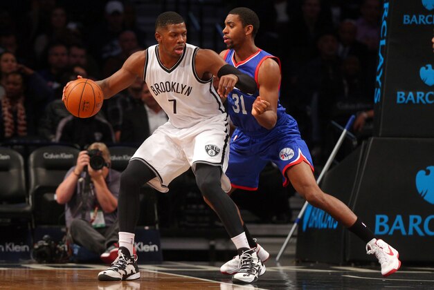 Oct 20, 2014; Brooklyn, NY, USA; Brooklyn Nets shooting guard Joe Johnson (7) controls the ball in front of Philadelphia 76ers shooting guard Hollis Thompson (31) during the first quarter at Barclays Center. Mandatory Credit: Brad Penner-USA TODAY Sports