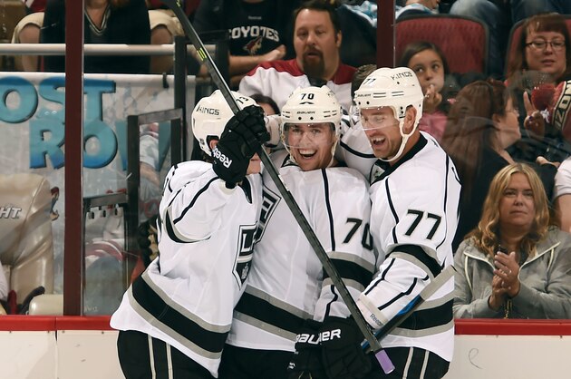GLENDALE, AZ - OCTOBER 11: Tanner Pearson #70 of the Los Angeles Kings (C) celebrates his goal against the Arizona Coyotes with teammates Tyler Toffoli #73 and Jeff Carter #77 during the first period at Gila River Arena on October 11, 2014 in Glendale, Arizona. (Photo by Norm Hall/NHLI via Getty Images)