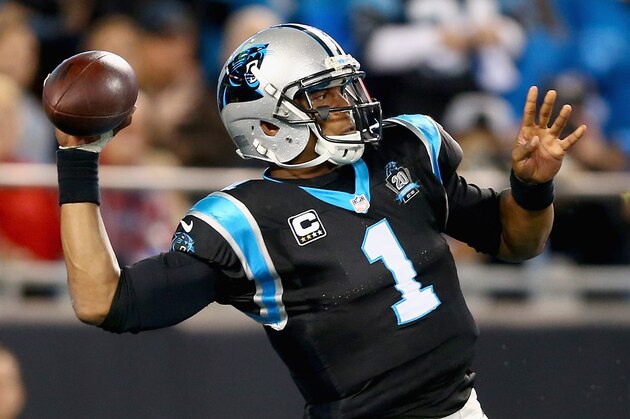 CHARLOTTE, NC - OCTOBER 30:   Cam Newton #1 of the Carolina Panthers throws a deep pass against the New Orleans Saints in the 1st half during their game at Bank of America Stadium on October 30, 2014 in Charlotte, North Carolina.  (Photo by Streeter Lecka/Getty Images)