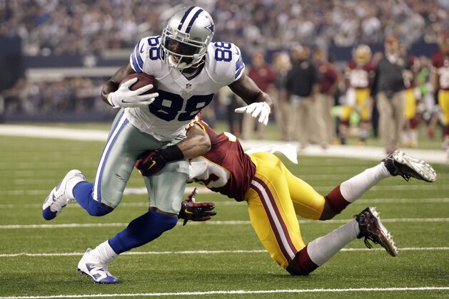 Dallas Cowboys wide receiver Dez Bryant (88) makes a touchdown reception as Washington Redskins cornerback David Amerson (39) defends during the first half of an NFL football game, Monday, Oct. 27, 2014, in Arlington, Texas. Washington won 20-17 in overtime. (AP Photo/Tim Sharp)