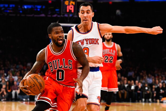NEW YORK, NY - OCTOBER 29: Aaron Brooks #0 of the Chicago Bulls drives past Pablo Prigioni #9 of the New York Knicks in the second quarter during a game at Madison Square Garden on October 29, 2014 in New York City. NOTE TO USER: User expressly acknowledges and agrees that, by downloading and/or using this photograph, user is consenting to the terms and conditions of the Getty Images License Agreement.  (Photo by Alex Goodlett/Getty Images)
