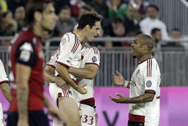 AC Milan's Giacomo Bonaventura, left, celebrates after scoring during a Serie A soccer match between Cagliari and AC Milan, in Cagliari, Italy, Wednesday, Oct. 29, 2014. (AP Photo/Daniela Santoni)