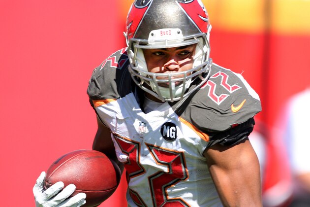 Tampa Bay Buccaneers running back Doug Martin (22) runs with the ball during the second half of an NFL football game against the Minnesota Vikings, Sunday,  Oct. 26, 2014, in Tampa, Fla. The Vikings won 19-13. (AP Photo/Reinhold Matay)