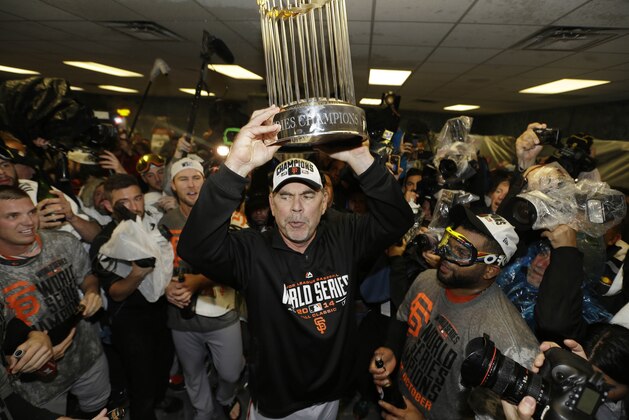 San Francisco Giants manager Bruce Bochy celebrates after Game 7 of baseball's World Series against the Kansas City Royals, Wednesday, Oct. 29, 2014, in Kansas City, Mo. The Giants won 3-2 to win the series. (AP Photo/David J. Phillip)