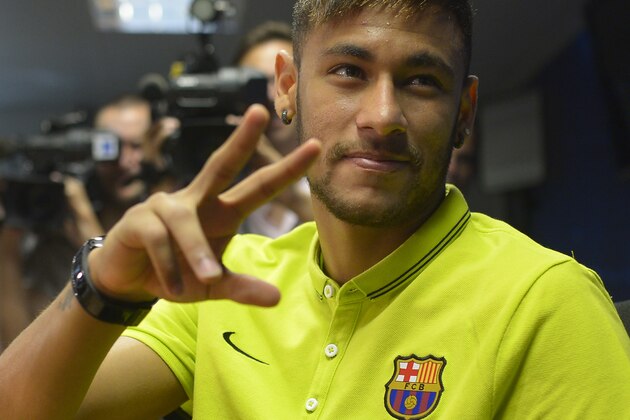 FC Barcelona's Neymar from Brazil gestures during a press conference at the Sports Center FC Barcelona Joan Gamper in San Joan Despi, Spain, Monday, Oct. 20, 2014. FC Barcelona will play against Ajax in a group F Champions League on Tuesday Oct. 21. (AP Photo/Manu Fernandez)