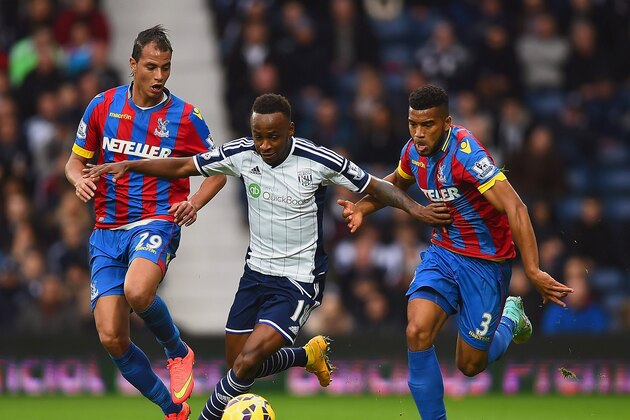 WEST BROMWICH, ENGLAND - OCTOBER 25: Saido Berahino of West Brom is closed down by Marouane Chamakh (L) and Adrian Mariappa of Crystal Palace during the Barclays Premier League match between West Bromwich Albion and Crystal Palace at The Hawthorns on October 25, 2014 in West Bromwich, England.  (Photo by Laurence Griffiths/Getty Images)