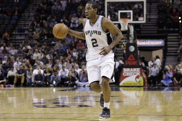 San Antonio Spurs' Kawhi Leonard (2) during the first half of an NBA basketball game against the Phoenix Suns, Wednesday, Nov. 6, 2013, in San Antonio. (AP Photo/Eric Gay)