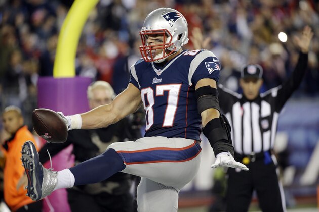 New England Patriots tight end Rob Gronkowski celebrates his touchdown catch against the Cincinnati Bengals in the second half of an NFL football game Sunday, Oct. 5, 2014, in Foxborough, Mass. (AP Photo/Stephan Savoia)