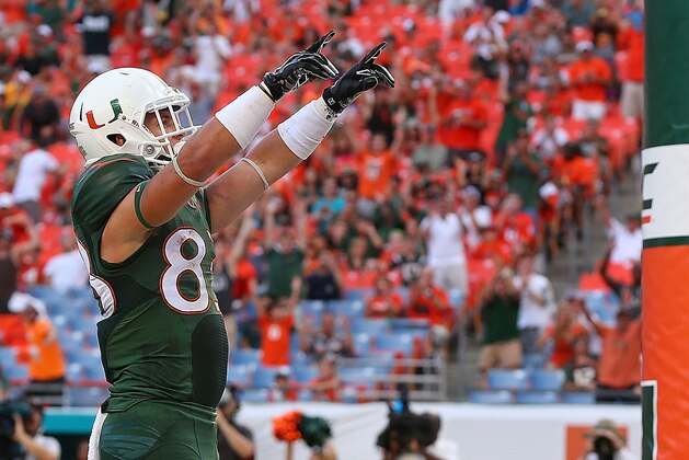 MIAMI, FL - SEPTEMBER 13:  Braxton Berrios #83 of the Miami Hurricanes celebrates a touchdown during a game against the Arkansas State Red Wolves at Sunlife Stadium on September 13, 2014 in Miami, Florida.  (Photo by Mike Ehrmann/Getty Images)