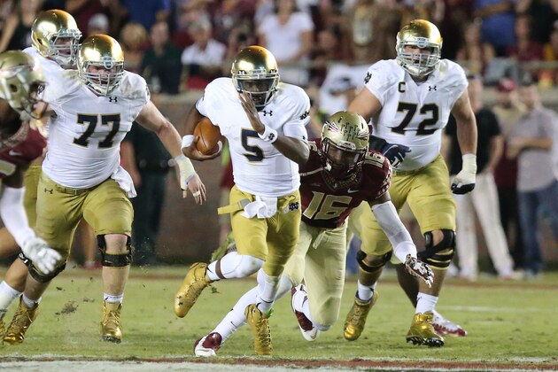 Notre Dame's Everett Golson carries as Florida State's Jacob Pugh comes in for the tackle during the second quarter of an NCAA college football game, Saturday, Oct. 18, 2014, in Tallahassee, Fla. Florida State won 31-27. (AP Photo/Steve Cannon)