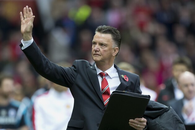 Manchester United's manager Louis van Gaal waves as he walks down the touchline before his team's English Premier League soccer match against Chelsea at Old Trafford Stadium, Manchester, England, Sunday Oct. 26, 2014. (AP Photo/Jon Super)