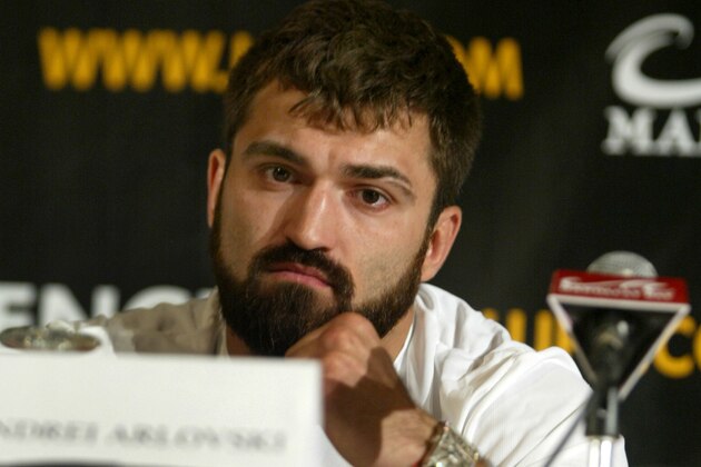 Andrei Arlovski, Former Heavyweight Champion, puts his fists up while Ultimate Fighting Championship Heavyweight Champion Tim Sylvia speaks, (not pictured), during the pre-fight press conference to promote the UFC 61 at the Mandalay Bay Events Center in Las Vegas on Thursday July 6, 2006. Bitter rivals Ultimate Fighting Championship Heavyweight Champion Tim Sylvia will fight former Heavyweight Champion Andrei Arlovski for the World Heavyweight Championship title at the Mandalay Bay Events Center in Las Vegas on Saturday, July 8, 2006. (AP Photo/Jane Kalinowsky)