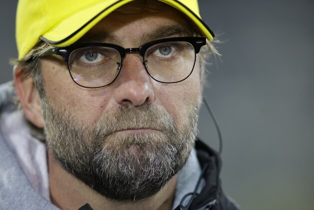 Dortmund's head coach Juergen Klopp listens to a question during a TV interview prior to the German soccer cup second round match between FC St. Pauli and Borussia Dortmund at the Millerntor Stadium in Hamburg, Germany, Tuesday, Oct. 28, 2014. (AP Photo/Michael Sohn)