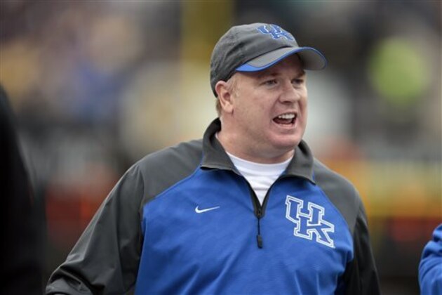 FILE - In this Nov. 16, 2013 file photo, Kentucky head coach Mark Stoops watches from the sideline in the second quarter of an NCAA college football game against Vanderbilt in Nashville, Tenn. Stoops begins fall practice on Monday, Aug. 4, 2014, seeking progress in his second season. He's encouraged by the Wildcats' attitude and improved grasp of the system and believes that can end a string of consecutive 2-10 finishes.(AP Photo/Mark Humphrey, File)