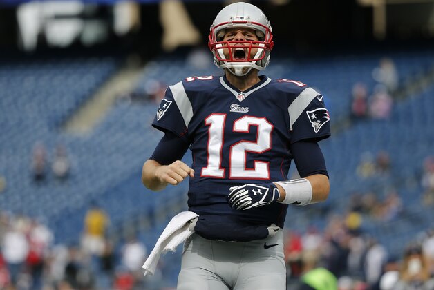 New England Patriots quarterback Tom Brady shouts as he runs onto the field before an NFL football game against the Chicago Bears on Sunday, Oct. 26, 2014, in Foxborough, Mass. (AP Photo/Elise Amendola)