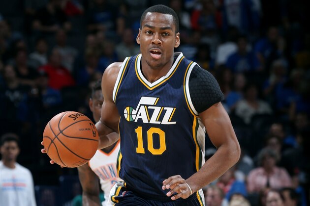 OKLAHOMA CITY, OK - OCTOBER 21: Alec Burks #10 of the Utah Jazz drives against the Oklahoma City Thunder on October 21, 2014 at Chesapeake Energy Arena in Oklahoma City, OK. NOTE TO USER: User expressly acknowledges and agrees that, by downloading and or using this photograph, User is consenting to the terms and conditions of the Getty Images License Agreement. Mandatory Copyright Notice: Copyright 2014 NBAE (Photo by Layne Murdoch/NBAE via Getty Images)