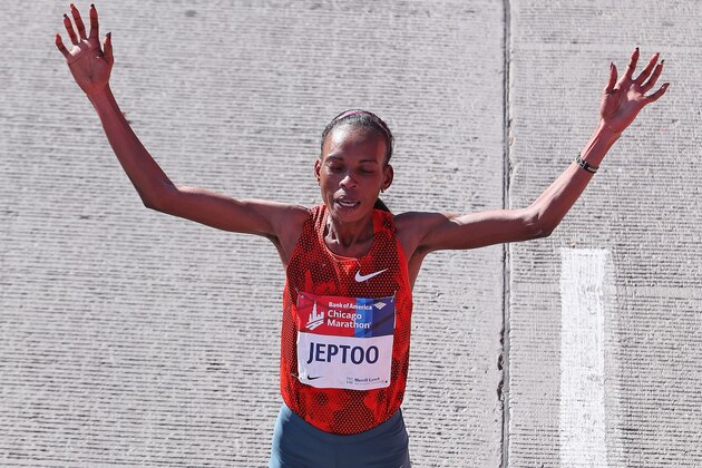 CHICAGO, IL - OCTOBER 12:  Rita Jeptoo of Kenya celebrates after winning of the 2014 Bank of America Chicago Marathon on October 12, 2014 in Chicago, Illinois.  (Photo by Jonathan Daniel/Getty Images)