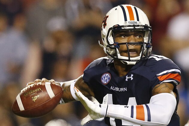 Auburn quarterback Nick Marshall (14) sets back to throw the ball against South Carolina during the second half of an NCAA college football game Saturday, Oct. 25, 2014, in Auburn, Ala. Auburn won 42-35. (AP Photo/Brynn Anderson)