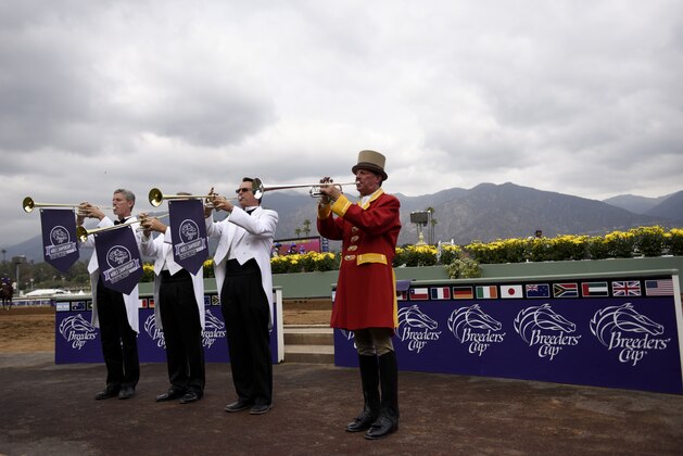 Buglers warm up before the start of the Breeders Cup horse races Friday, Oct. 31, 2014 at Santa Anita Park  in Arcadia, Calif. (AP Photo/Jae C. Hong)