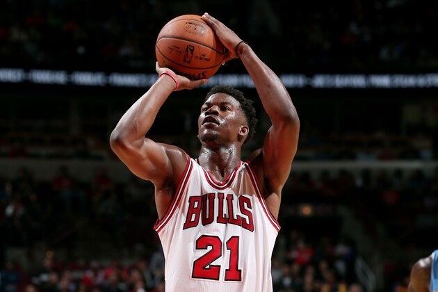 CHICAGO, IL - OCTOBER 13: Jimmy Butler #21 of the Chicago Bulls attempts a free throw against the Denver Nuggets on October 13, 2014 at United Center, Chicago, Illinois. NOTE TO USER: User expressly acknowledges and agrees that, by downloading and or using this Photograph, user is consenting to the terms and conditions of the Getty Images License Agreement. Mandatory Copyright Notice: Copyright 2014 NBAE (Photo by Gary Dineen/NBAE via Getty Images)