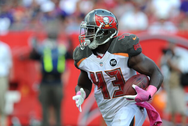 TAMPA, FL - OCTOBER 12: Running back Bobby Rainey #43 of the Tampa Bay Buccaneers carries the ball against the Baltimore Ravens at Raymond James Stadium on October 12, 2014 in Tampa, Florida. (Photo by Cliff McBride/Getty Images)