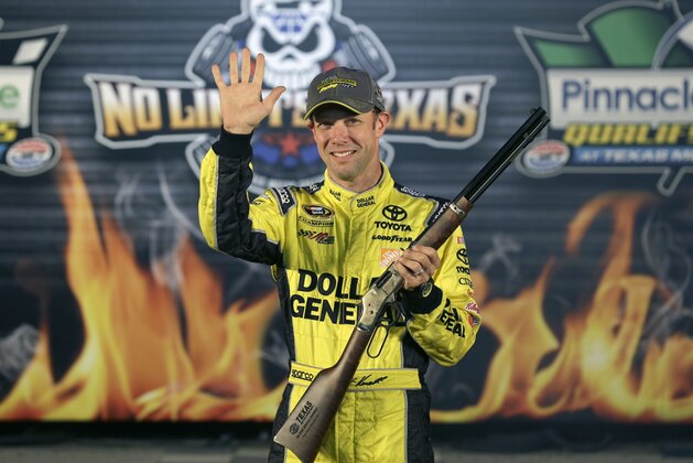Matt Kenseth waves in Victory Lane after taking the pole position for Sunday's NASCAR Sprint Cup Texas 500 auto race at Texas Motor Speedway in Fort Worth, Texas, Friday, Oct. 31, 2014. (AP Photo/LM Otero)