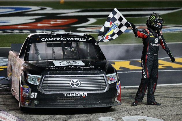 FORT WORTH, TX - OCTOBER 31:  Kyle Busch, driver of the #51 ToyotaCare Toyota, celebrates with the checkered flag after winning the NASCAR Camping World Truck Series WinStar World Casino & Resort 350 at Texas Motor Speedway on October 31, 2014 in Fort Worth, Texas.  (Photo by Todd Warshaw/Getty Images for Texas Motor Speedway)
