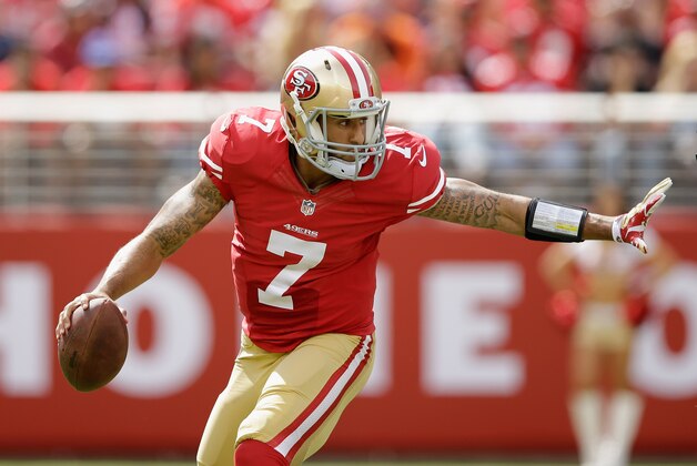 SANTA CLARA, CA - SEPTEMBER 28:  Colin Kaepernick #7 of the San Francisco 49ers scrambles with the ball against the Philadelphia Eagles at Levi's Stadium on September 28, 2014 in Santa Clara, California.  (Photo by Ezra Shaw/Getty Images)