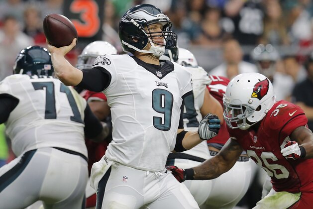 Philadelphia Eagles quarterback Nick Foles (9) throws against the Arizona Cardinals during the second half of an NFL football game, Sunday, Oct. 26, 2014, in Glendale, Ariz. (AP Photo/Rick Scuteri)