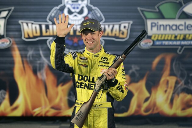 Matt Kenseth waves in Victory Lane after taking the pole position for Sunday's NASCAR Sprint Cup Texas 500 auto race at Texas Motor Speedway in Fort Worth, Texas, Friday, Oct. 31, 2014. (AP Photo/LM Otero)
