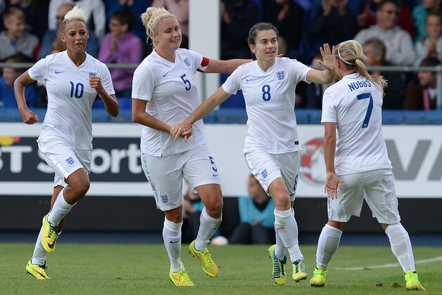 HARTLEPOOL, ENGLAND - AUGUST 3: Karen Carney (2ndR) of England celebrates scoring with teamates during the Women's International Friendly match between England and Sweden at Victoria Park on August 3, 2014 in Hartlepool, England. (Photo by Nigel Roddis/Getty Images)