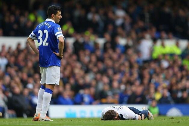 LIVERPOOL, ENGLAND - MAY 03:  Antolin Alcaraz of Everton looks on as Edin Dzeko of Manchester City lies on the pitch following a challenge during the Barclays Premier League match between Everton and Manchester City at Goodison Park on May 3, 2014 in Liverpool, England.  (Photo by Clive Brunskill/Getty Images)