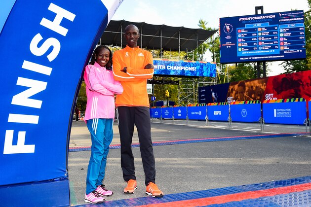 NEW YORK, NY - OCTOBER 30: Mary Keitany poses for a picture with Wilson Kipsang at the TCS New York City Marathon finish line on October 30, 2014 in New York City. (Photo by Alex Goodlett/Getty Images for adidas)