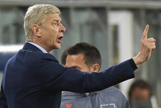 Arsenal's head coach Arsene Wenger, who celebrated his birthday, gives directions to his players during the Group D Champions League match between Anderlecht and Arsenal at Constant Vanden Stock Stadium in Brussels, Belgium, Wednesday Oct. 22, 2014. Arsenal won the match with a 2-1 score. (AP Photo/Geert Vanden Wijngaert)