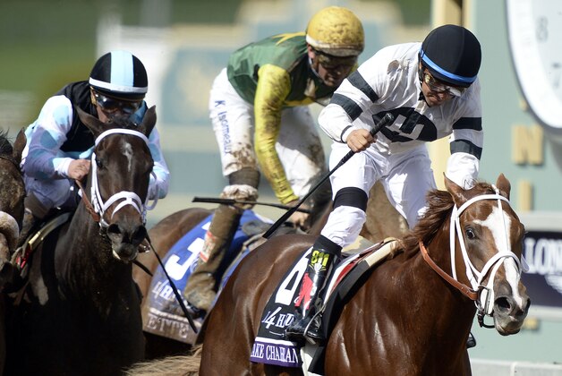 November 1, 2014; Santa Anita , CA, USA; Victor Espinoza aboard Take Charge Brandi sprints to the finish to win face four during the 2014 Breeders Cup Championships at Santa Anita Park.  Mandatory Credit: Robert Hanashiro-USA TODAY Sports