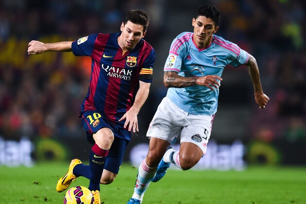 BARCELONA, SPAIN - NOVEMBER 01:  Lionel Messi of FC Barcelona competes for the ball with Charles of Celta de Vigo the La Liga match between FC Barcelona and Celta de Vigo at Camp Nou on November 1, 2014 in Barcelona, Spain.  (Photo by David Ramos/Getty Images)