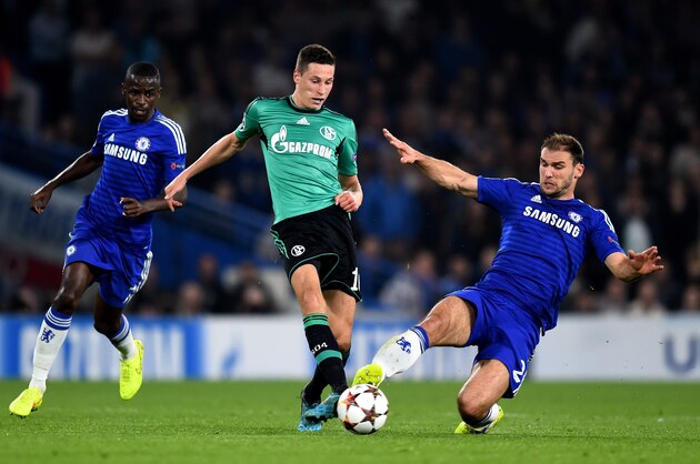 LONDON, ENGLAND - SEPTEMBER 17:  Julian Draxler of Schalke is tackled by Branislav Ivanovic of Chelsea  during the UEFA Champions League Group G match between Chelsea and FC Schalke 04 on September 17, 2014 in London, United Kingdom.  (Photo by Mike Hewitt/Getty Images)